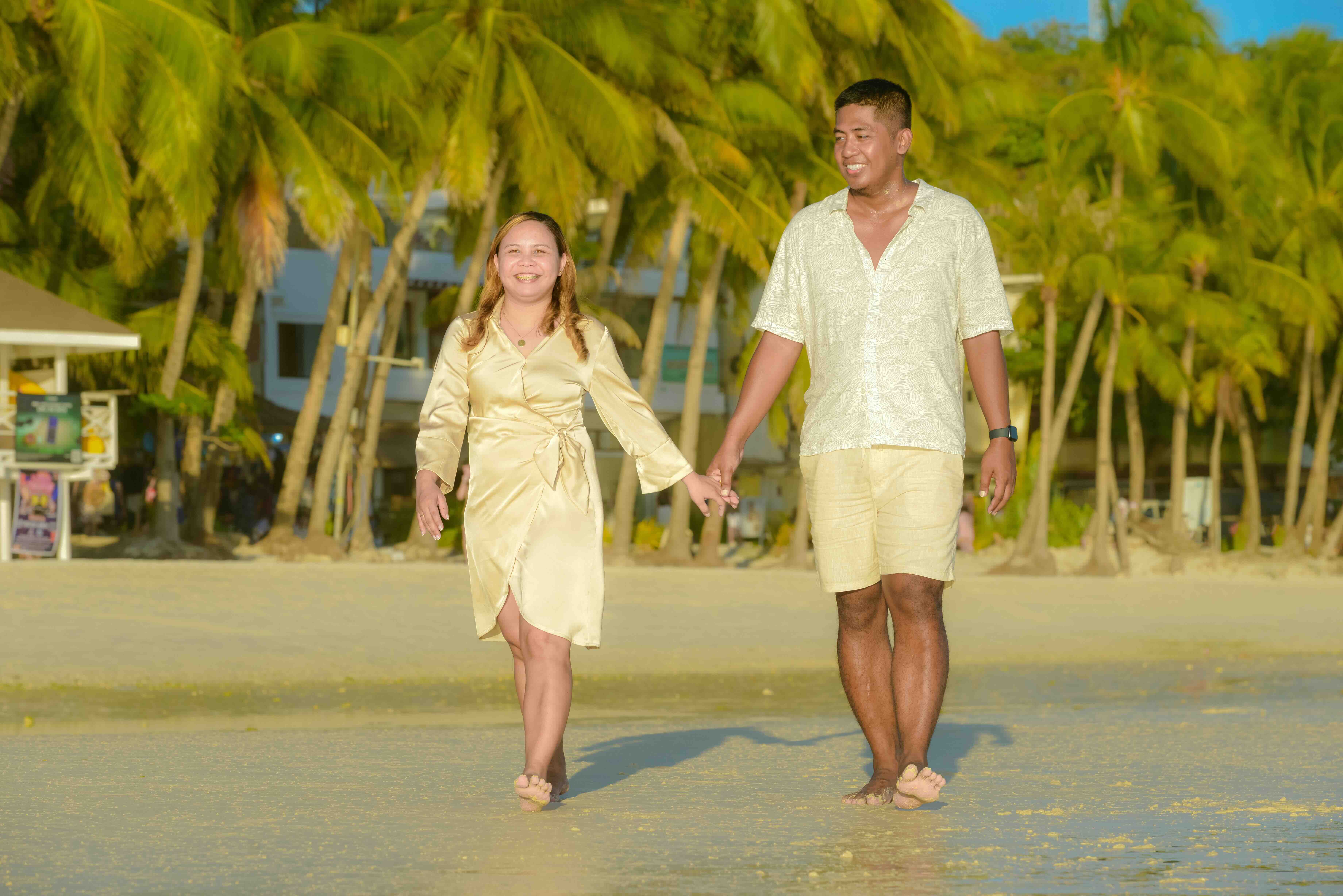 Jewel and Lloyd walking on the beach